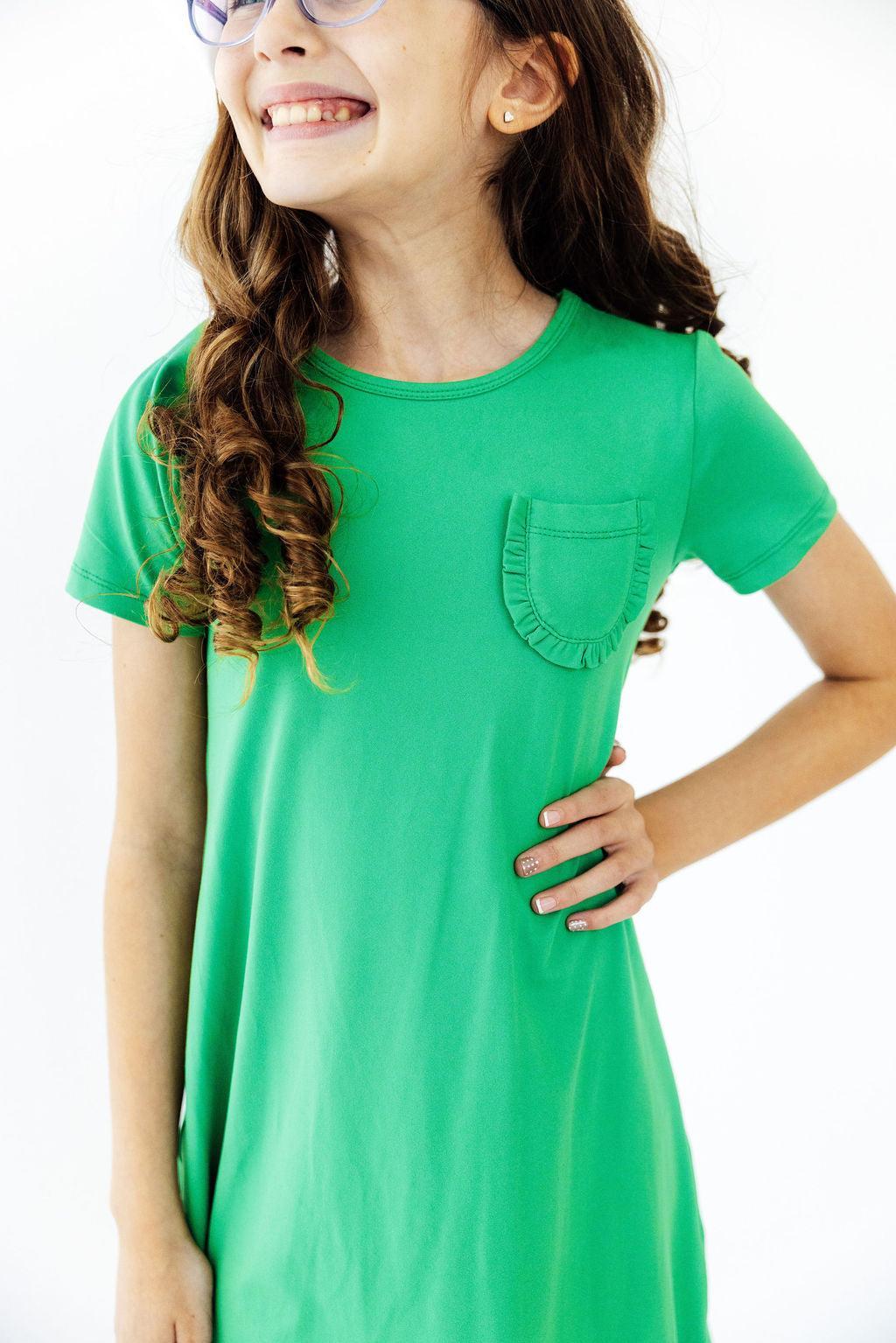 a woman in a green dress