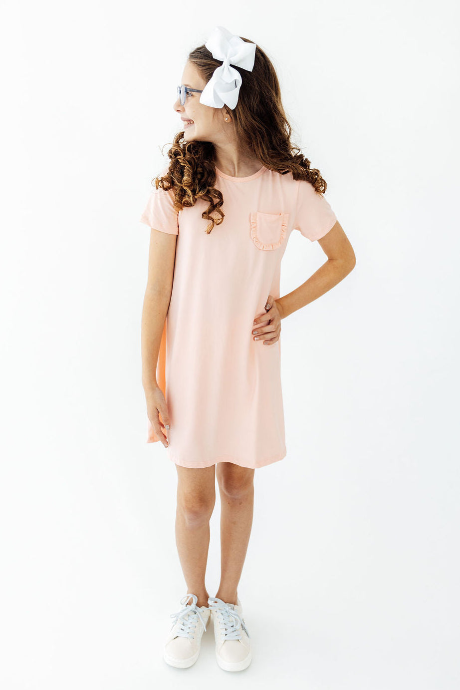 a girl in a pink dress