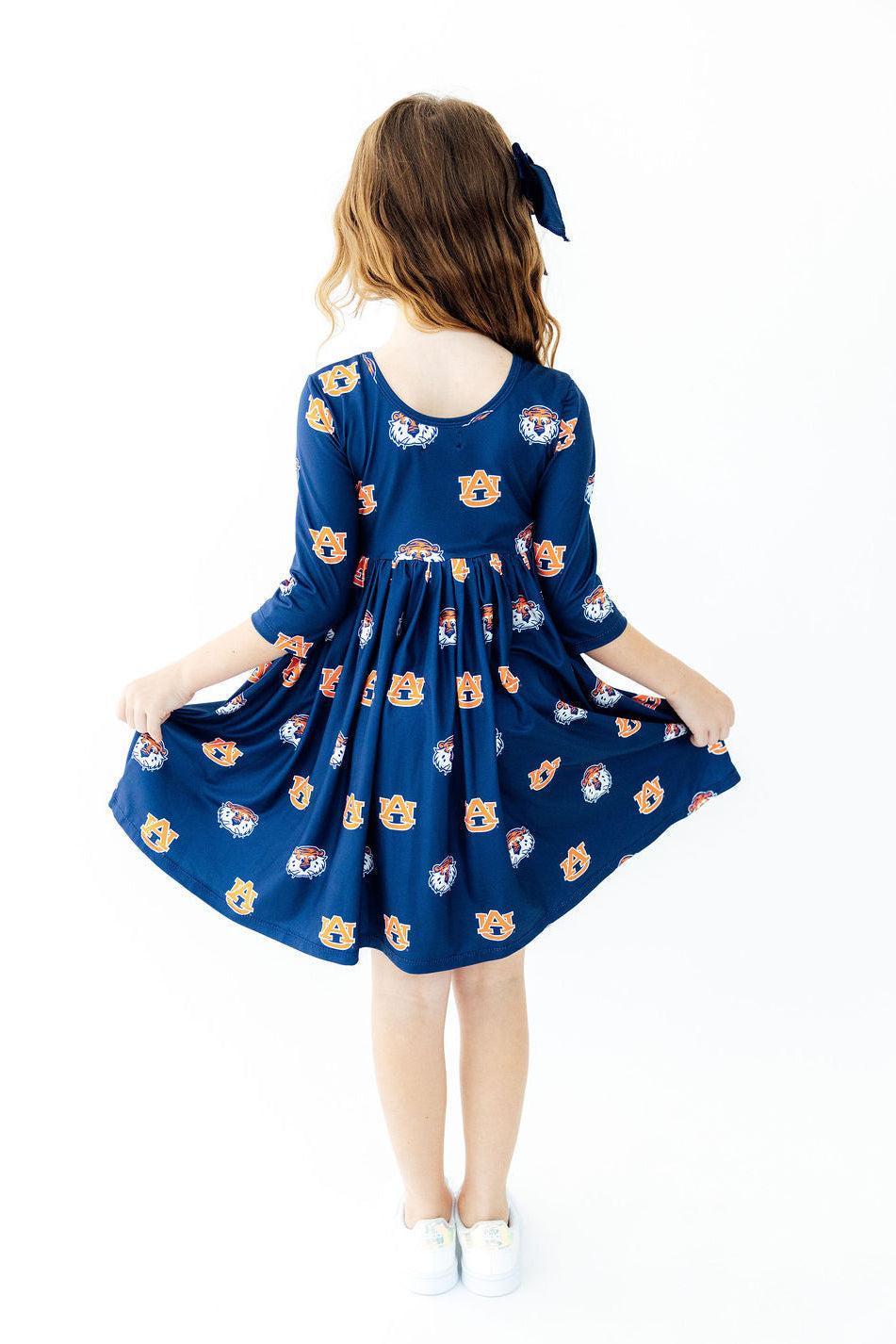 a girl in a blue dress