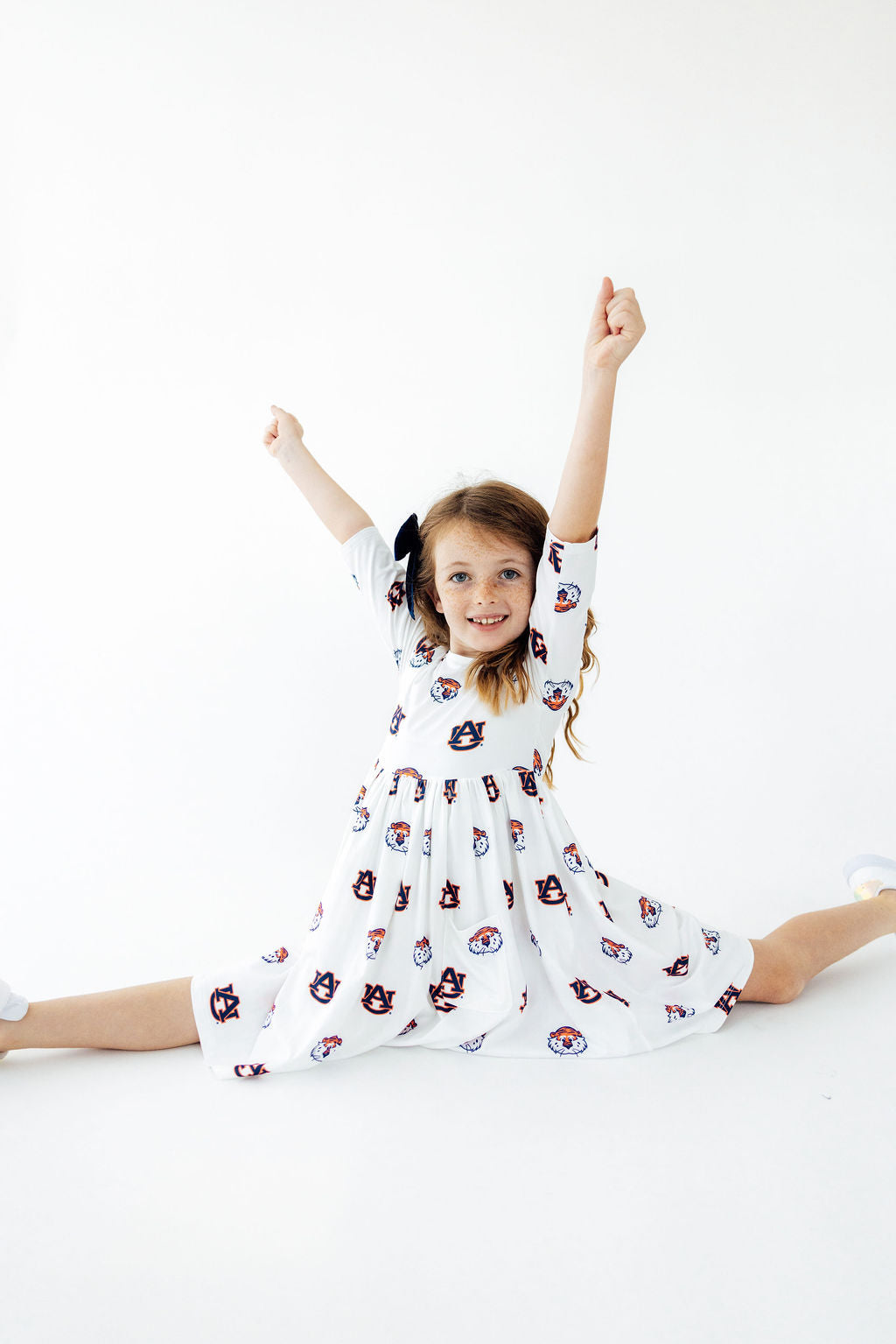 a girl in a white dress with a white background
