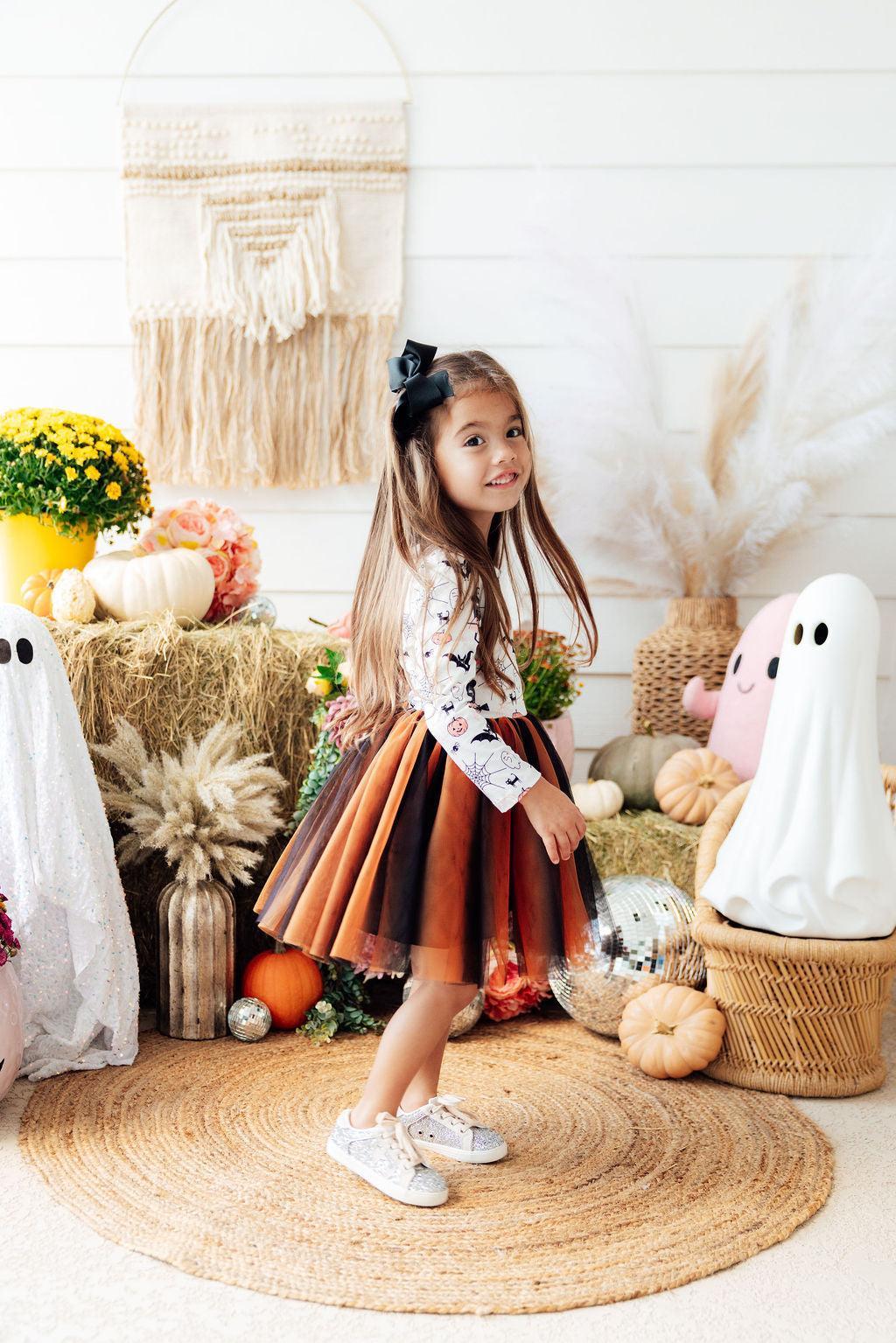 a girl in a tutu and a garment