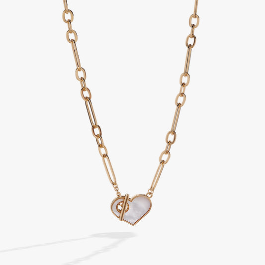 a gold chain with a heart pendant