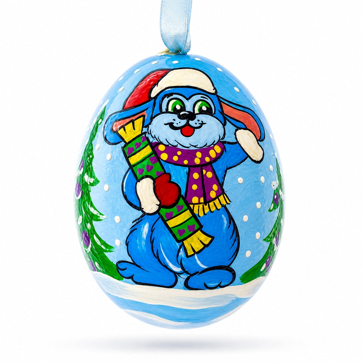 a painted egg with a rabbit and a scarf