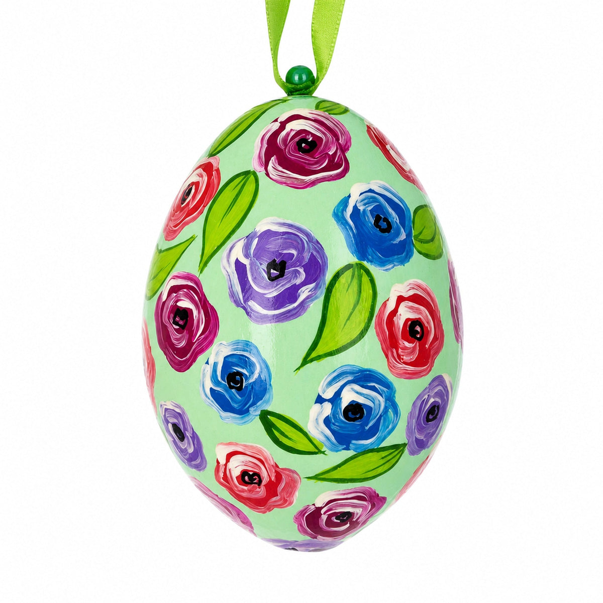 a painted egg with flowers on it