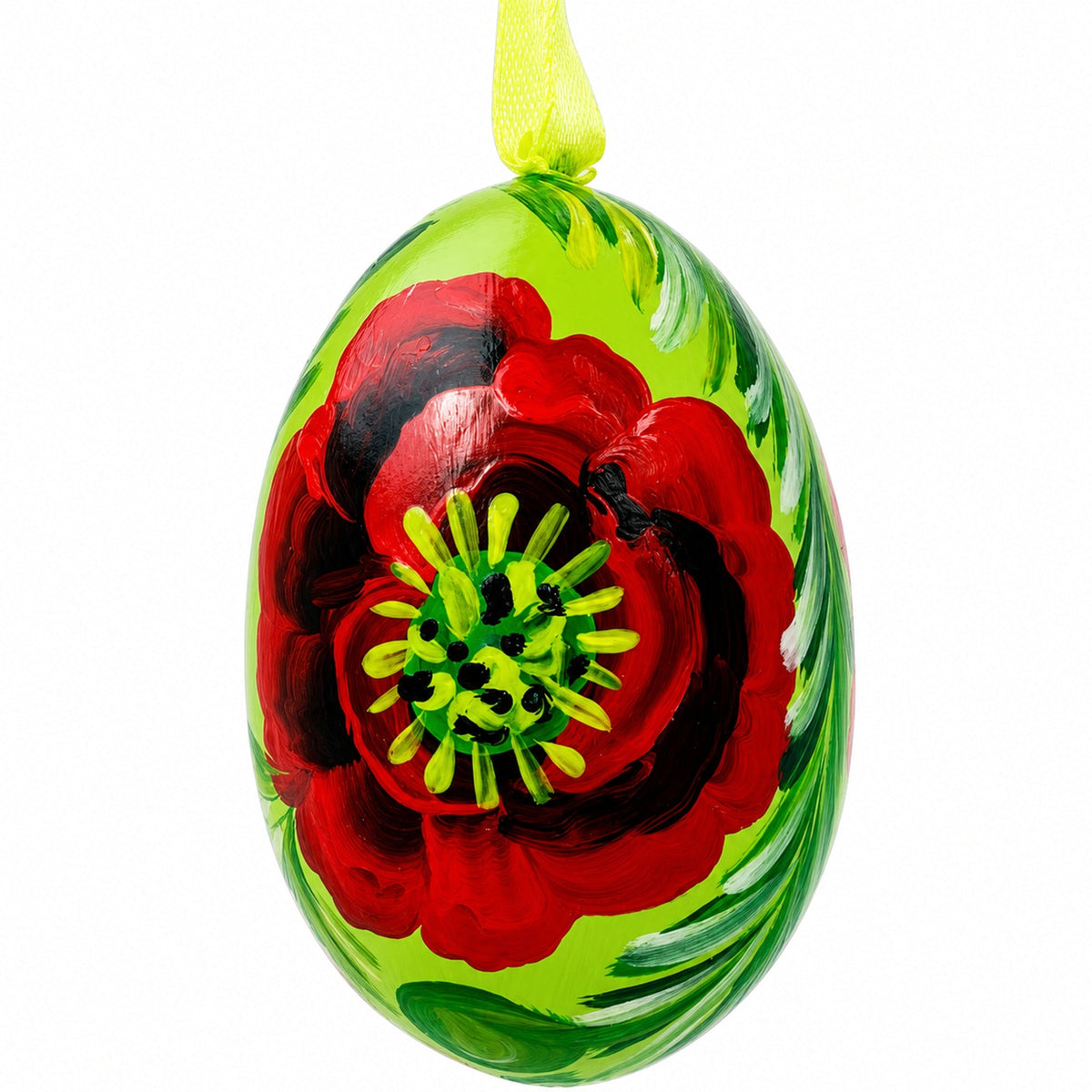 a green egg with a red flower painted on it