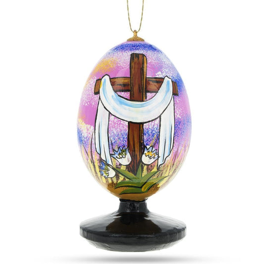 a painted egg with a cross on it