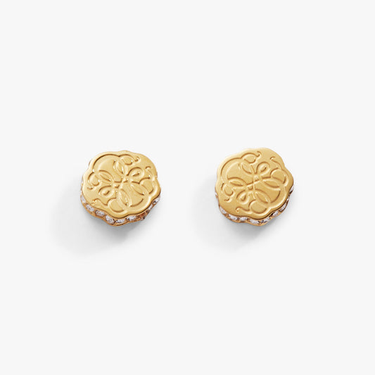 a pair of gold earrings with diamonds