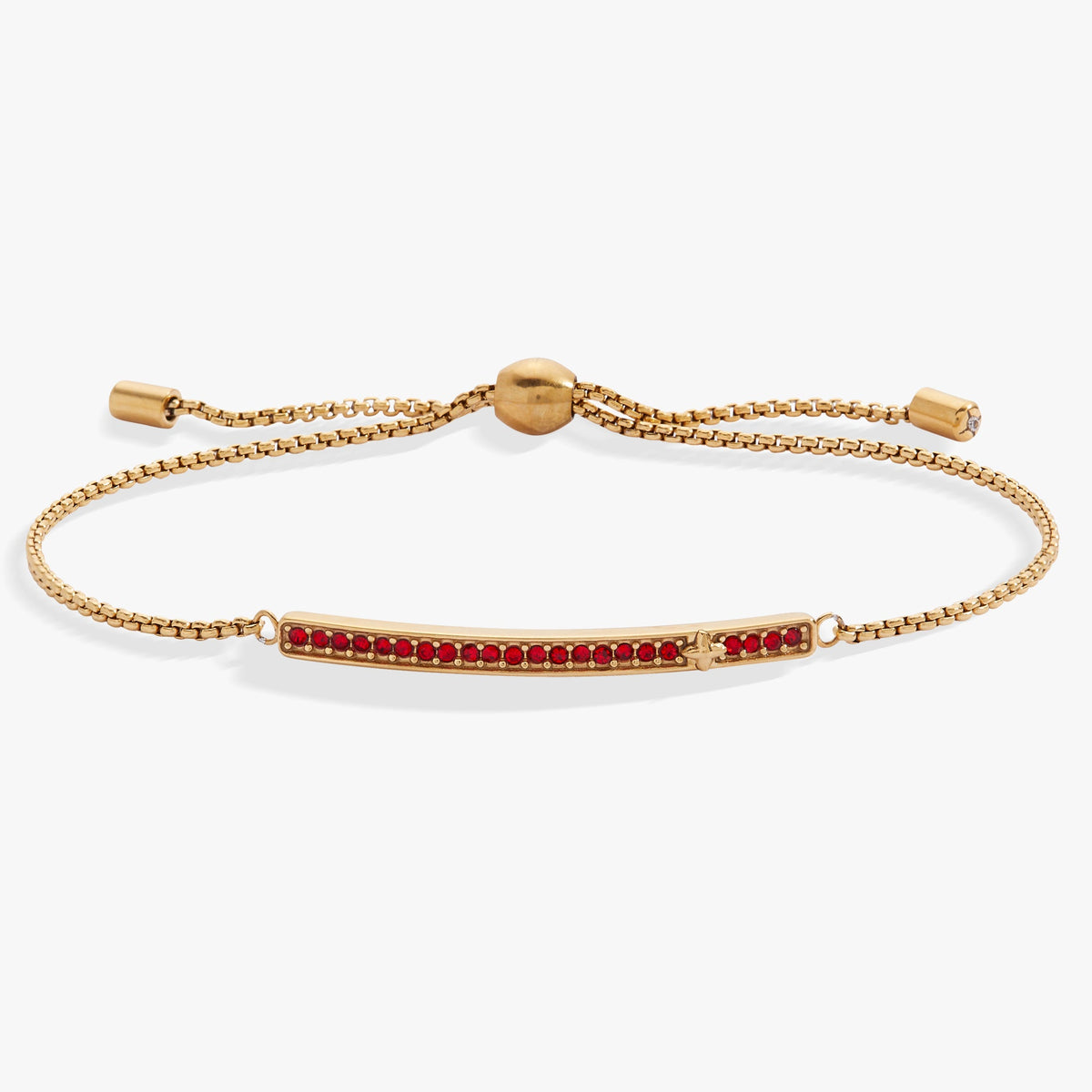 a gold bracelet with red stones