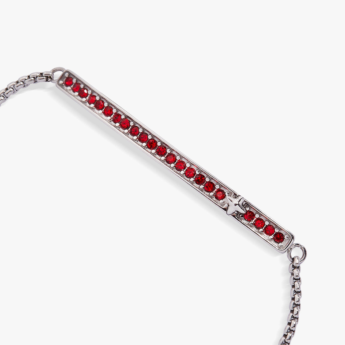 a silver bracelet with red stones