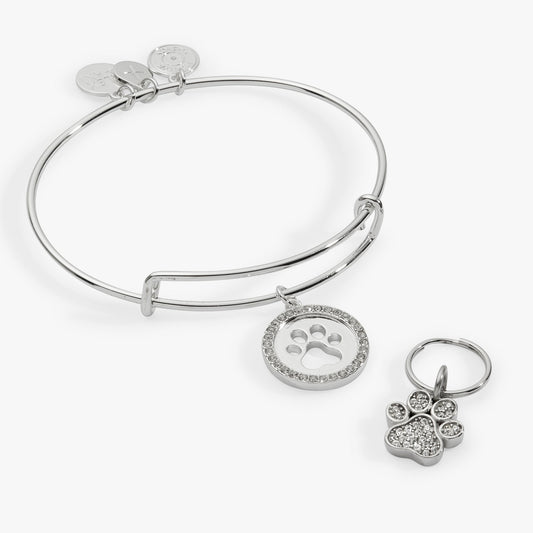 a silver bracelet with a paw print charm