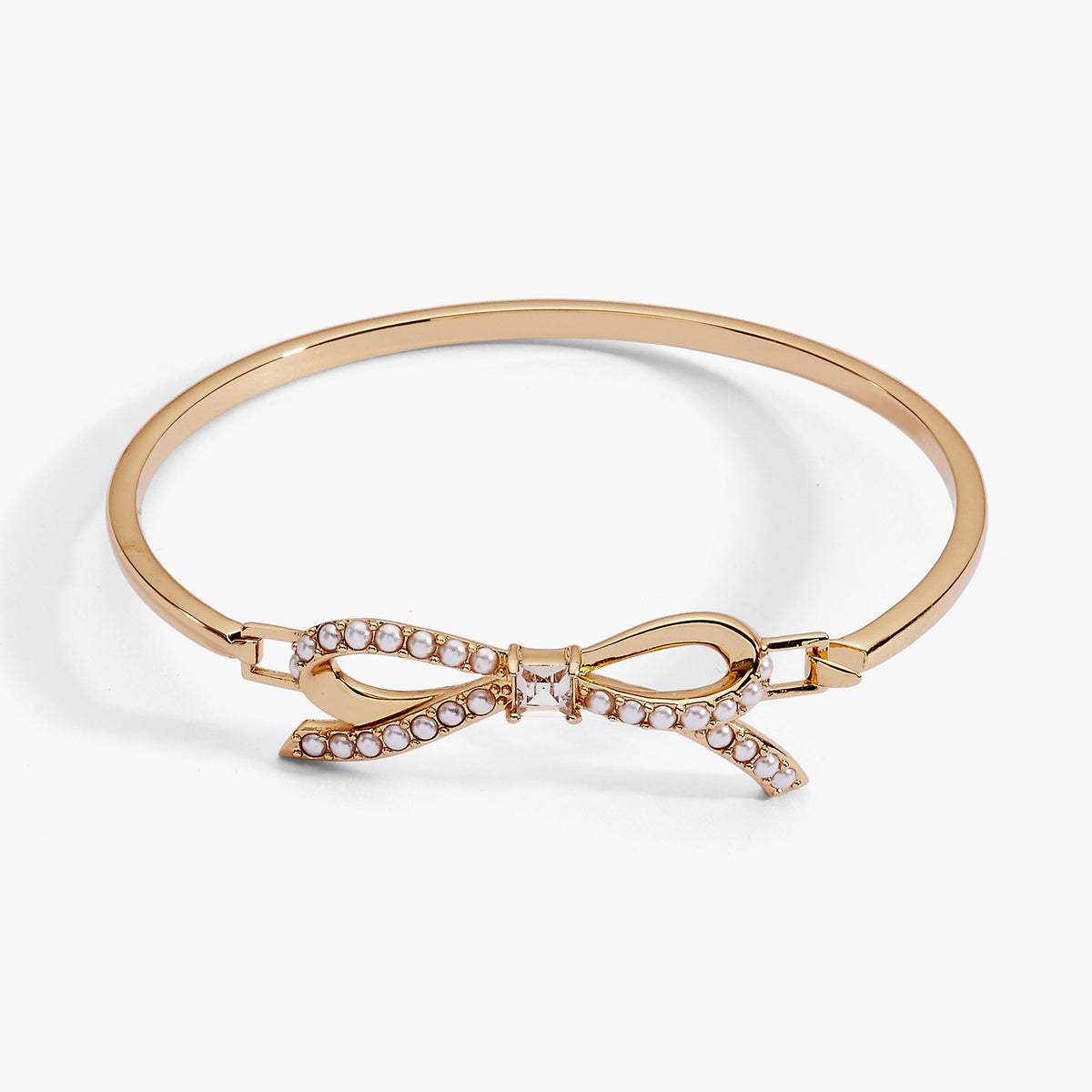 a gold bracelet with a bow