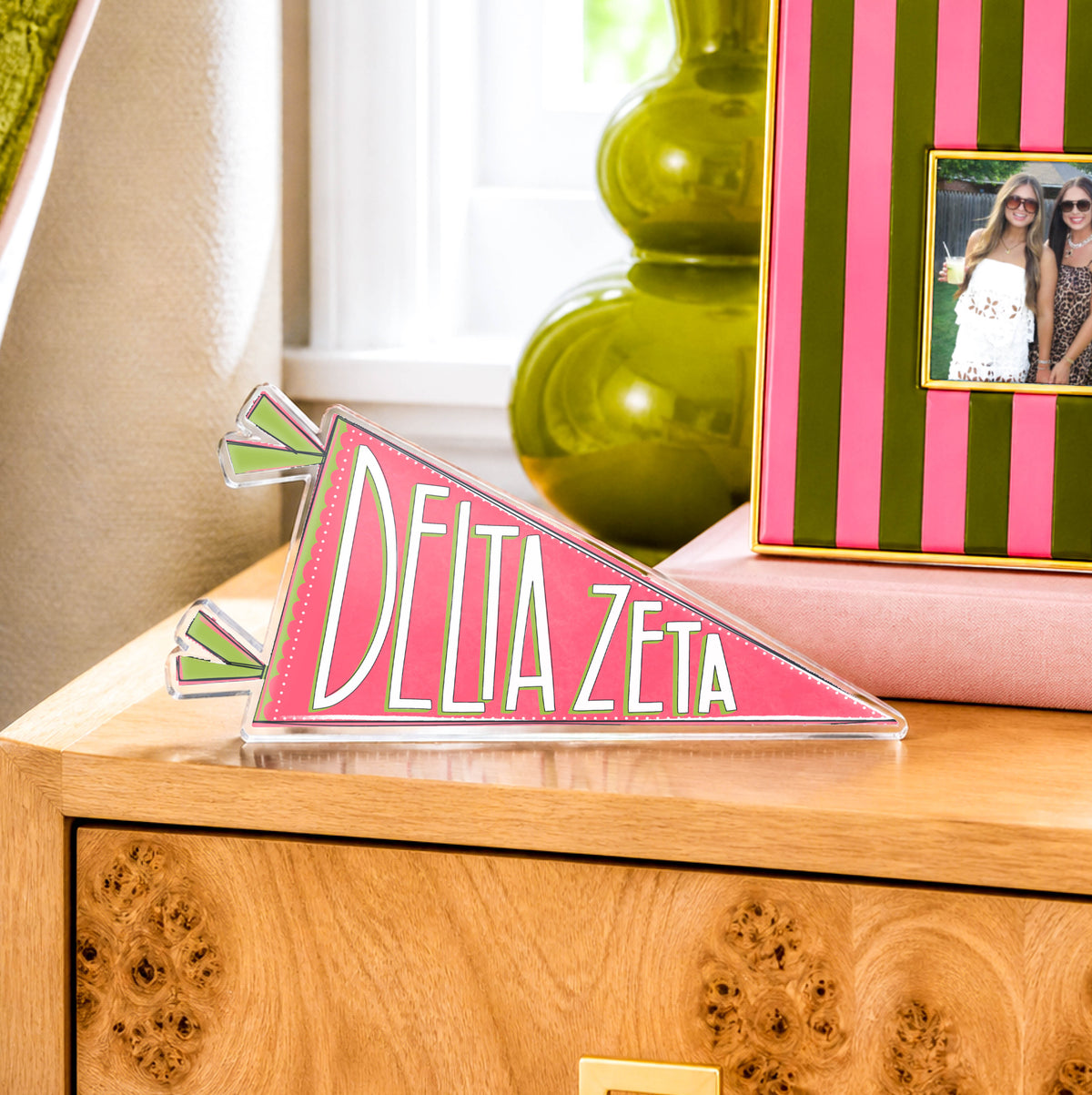 a pink triangle shaped object on a dresser
