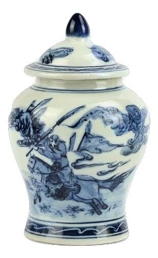 a blue and white ceramic jar