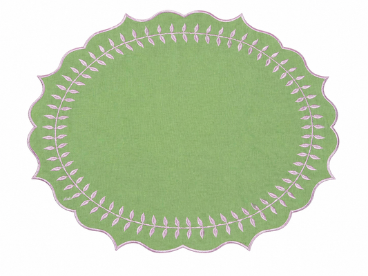 a green oval with pink and white leaves