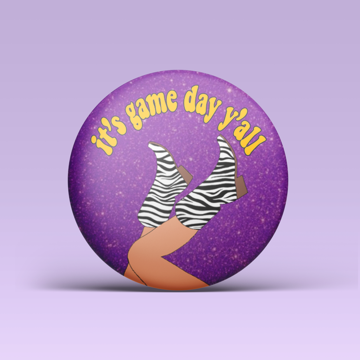 a purple button with a pair of legs and zebra boots