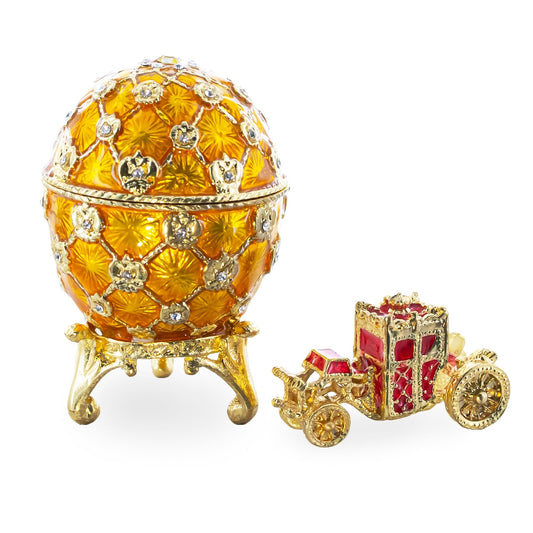 a gold and red egg shaped jewelry box