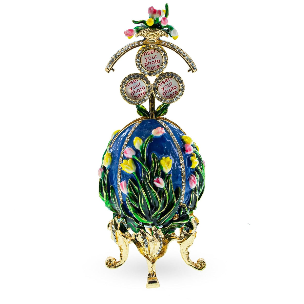 a decorative egg shaped object with flowers and a gold base