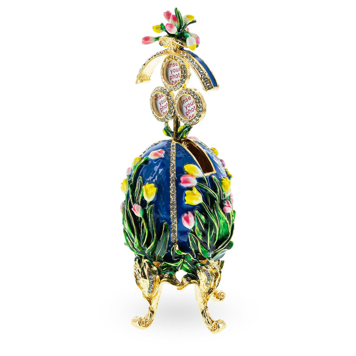 a blue egg shaped object with flowers and a gold stand