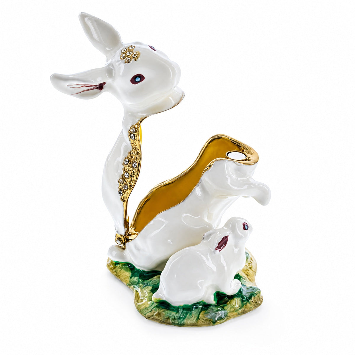 a white rabbit statue with gold trim