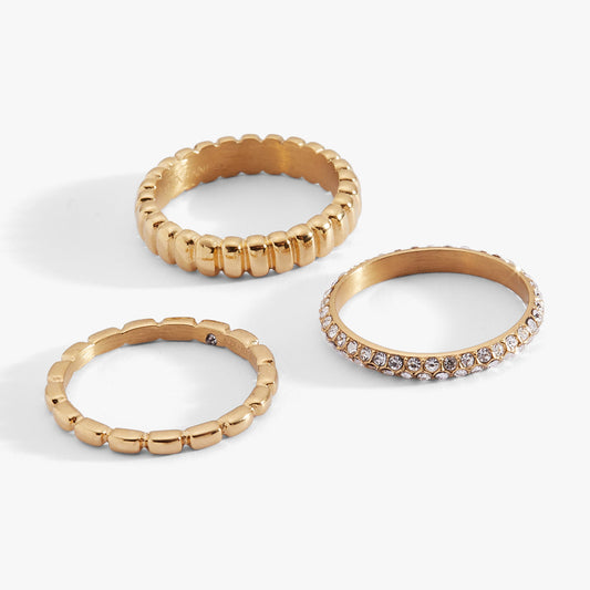 a group of gold rings with diamonds