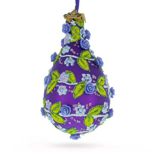 a purple and green decorated christmas ornament