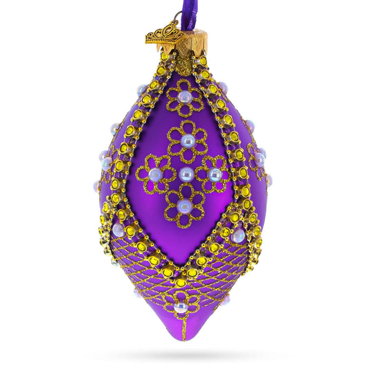 a purple and gold decorated christmas ornament