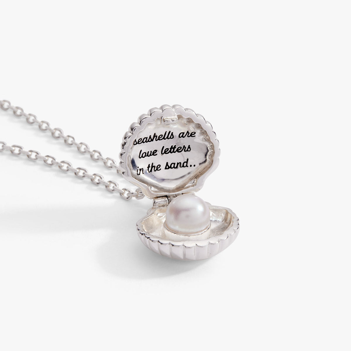 a silver necklace with a pearl in it