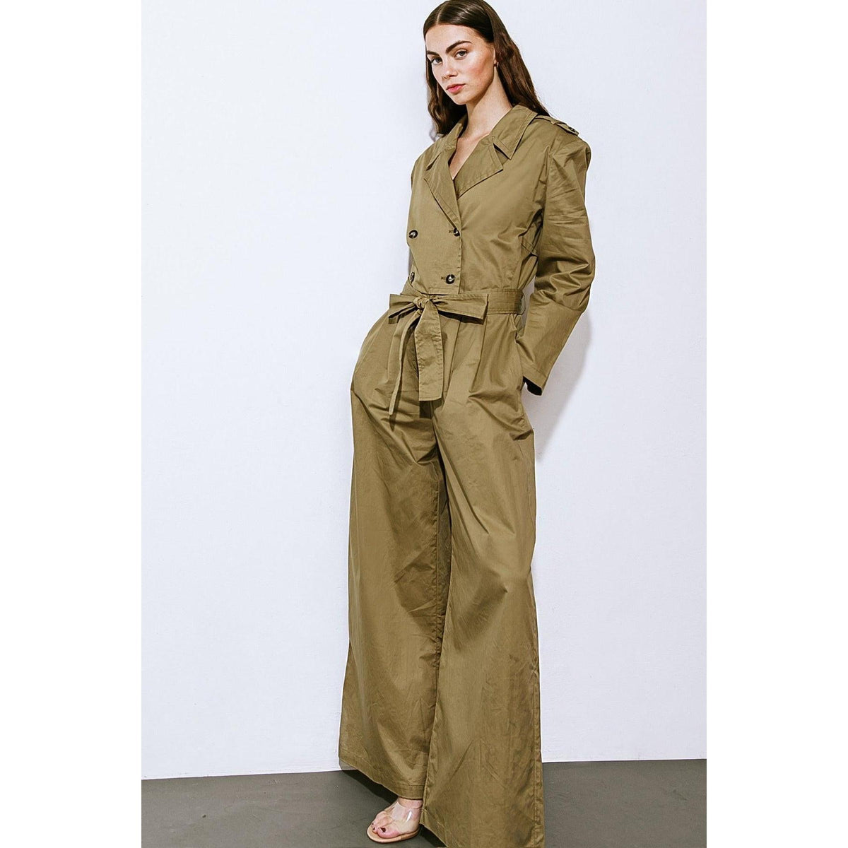 a woman in a green jumpsuit