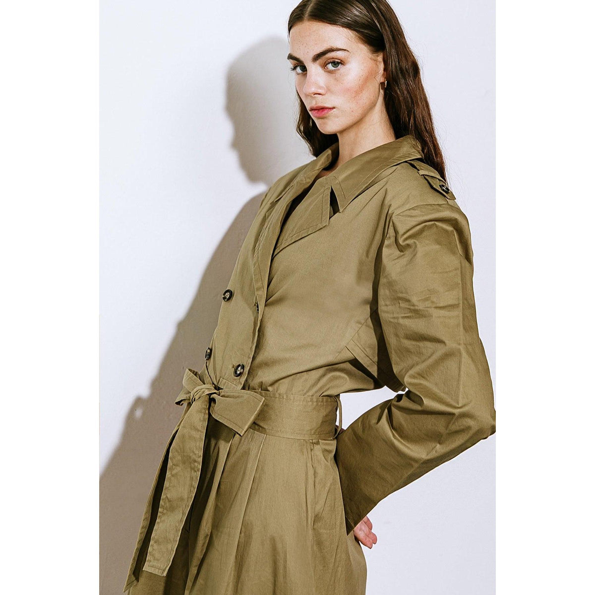 a woman in a trench coat