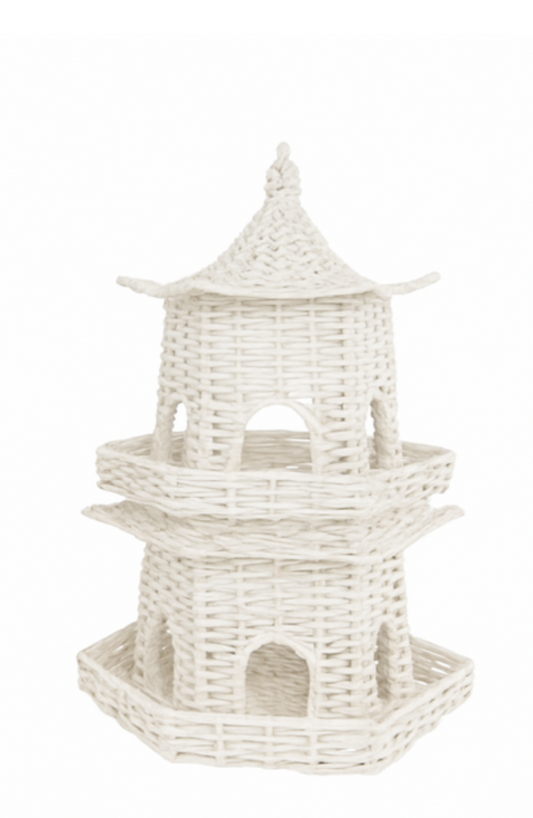 a white wicker structure with a roof