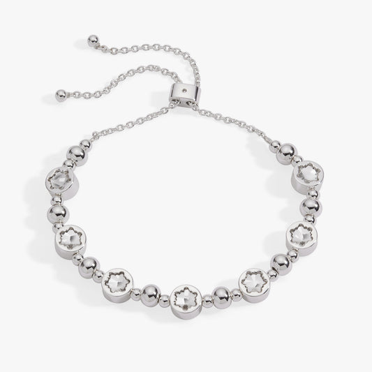 a silver bracelet with stars on it