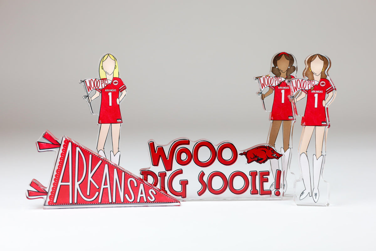 a group of paper cutouts of women holding signs