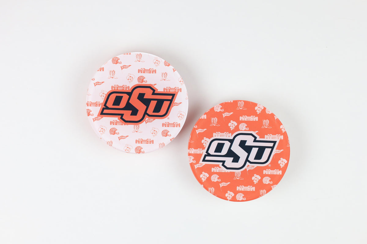 a pair of orange and white circular objects with designs