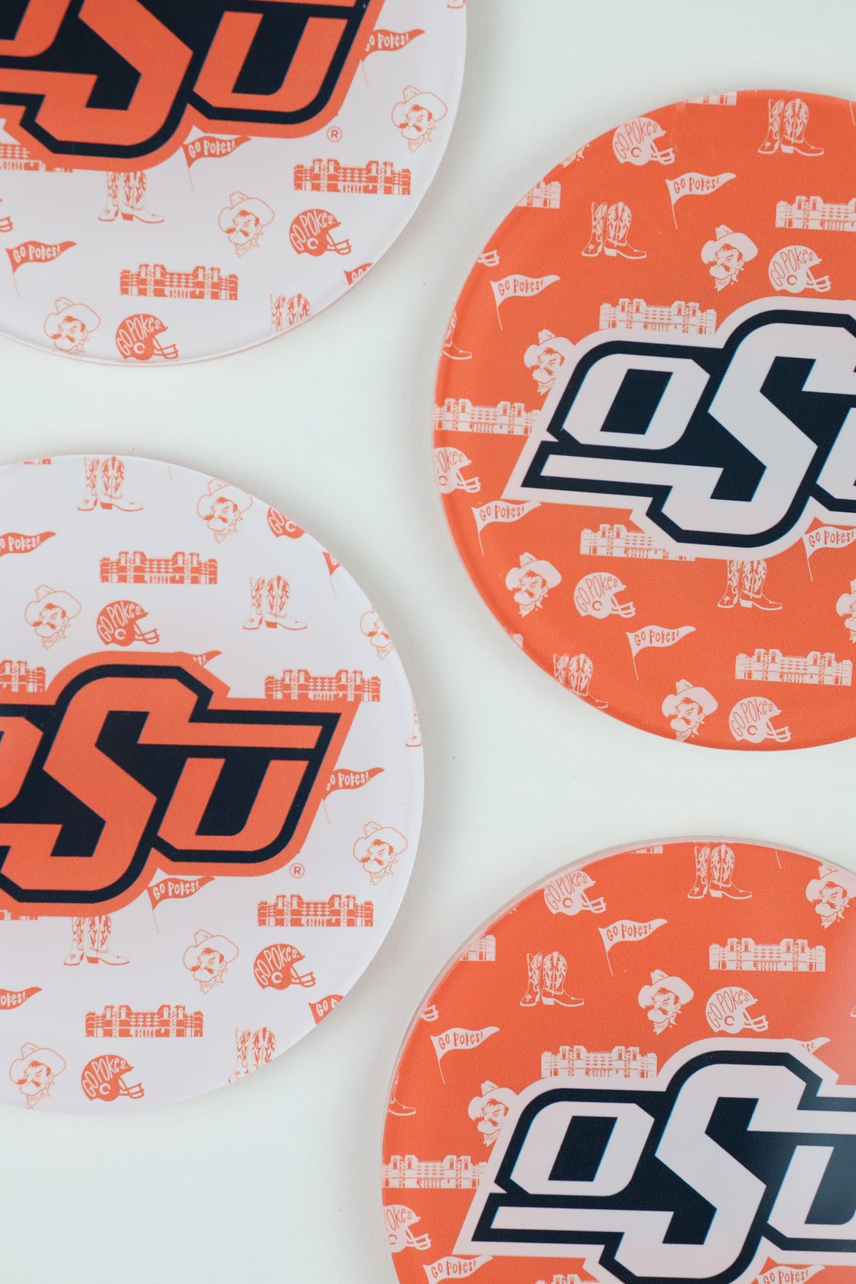 a group of orange and white plates with designs on them