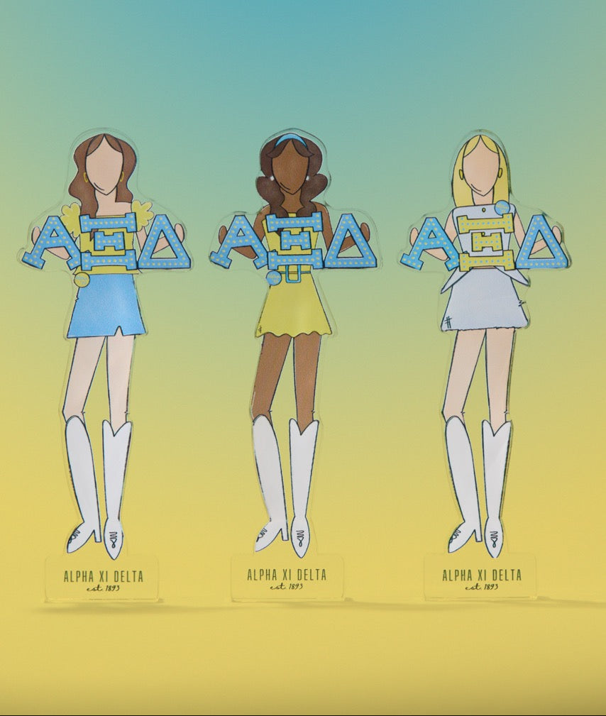 a group of cartoon girls holding letters