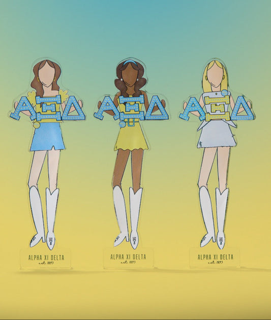 a group of cartoon girls holding letters