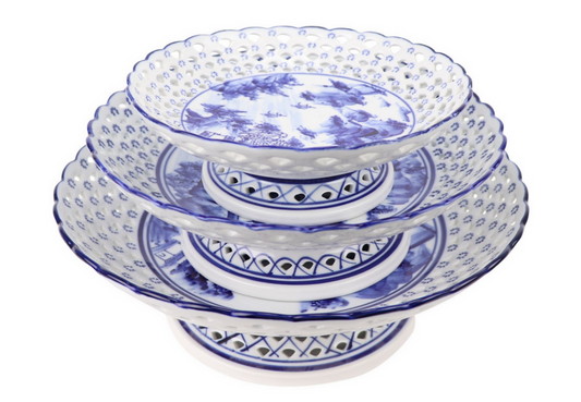a stack of blue and white plates