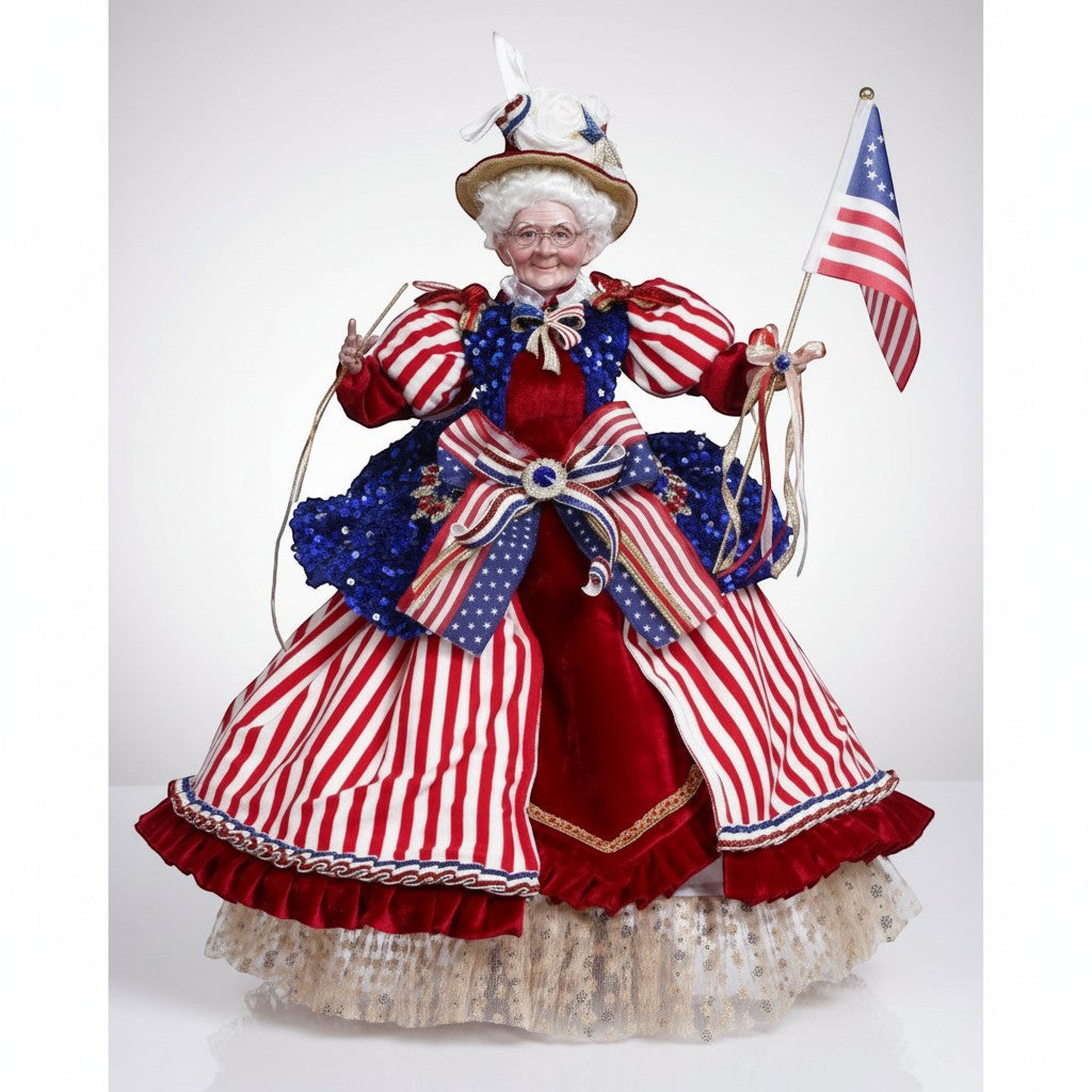 The Merry Hare Betsy Ross figurine, 23.5" tall, dressed in patriotic red, white, and blue attire, holding an American flag.
