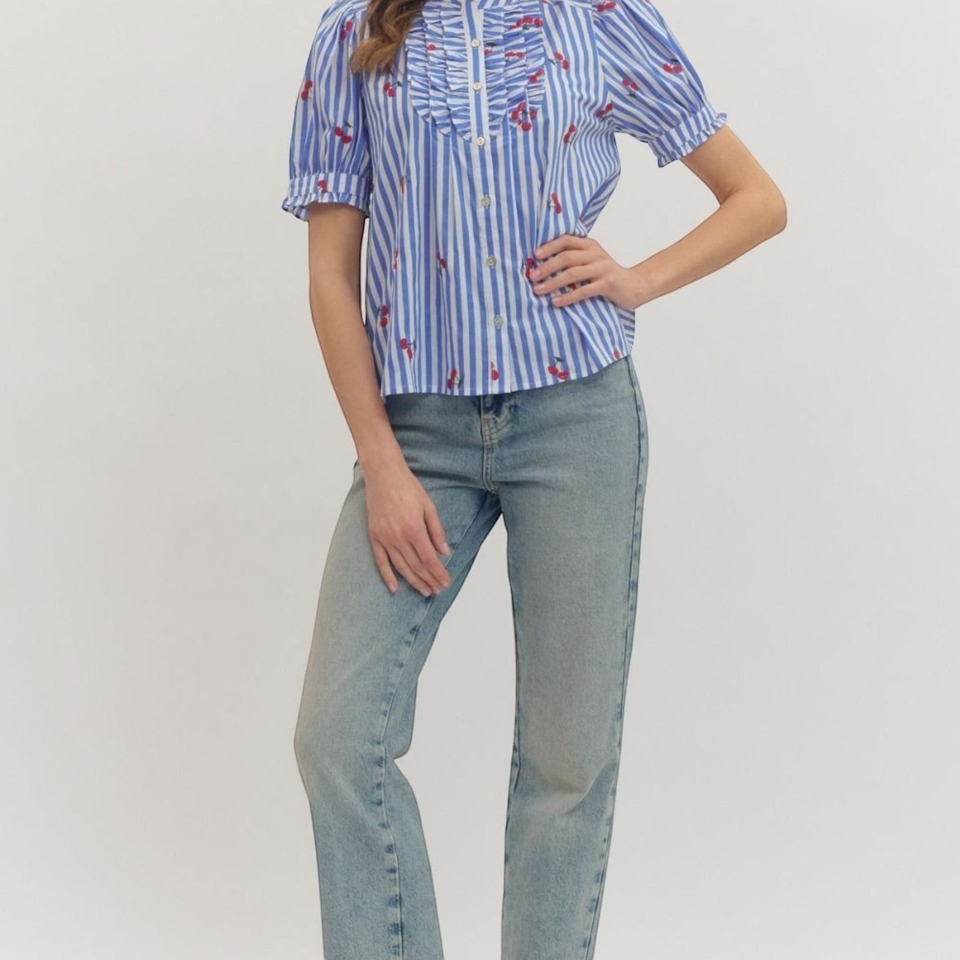 The Merry Hare blue striped cotton top with embroidered cherries, ruffle bib, and puff short sleeves.