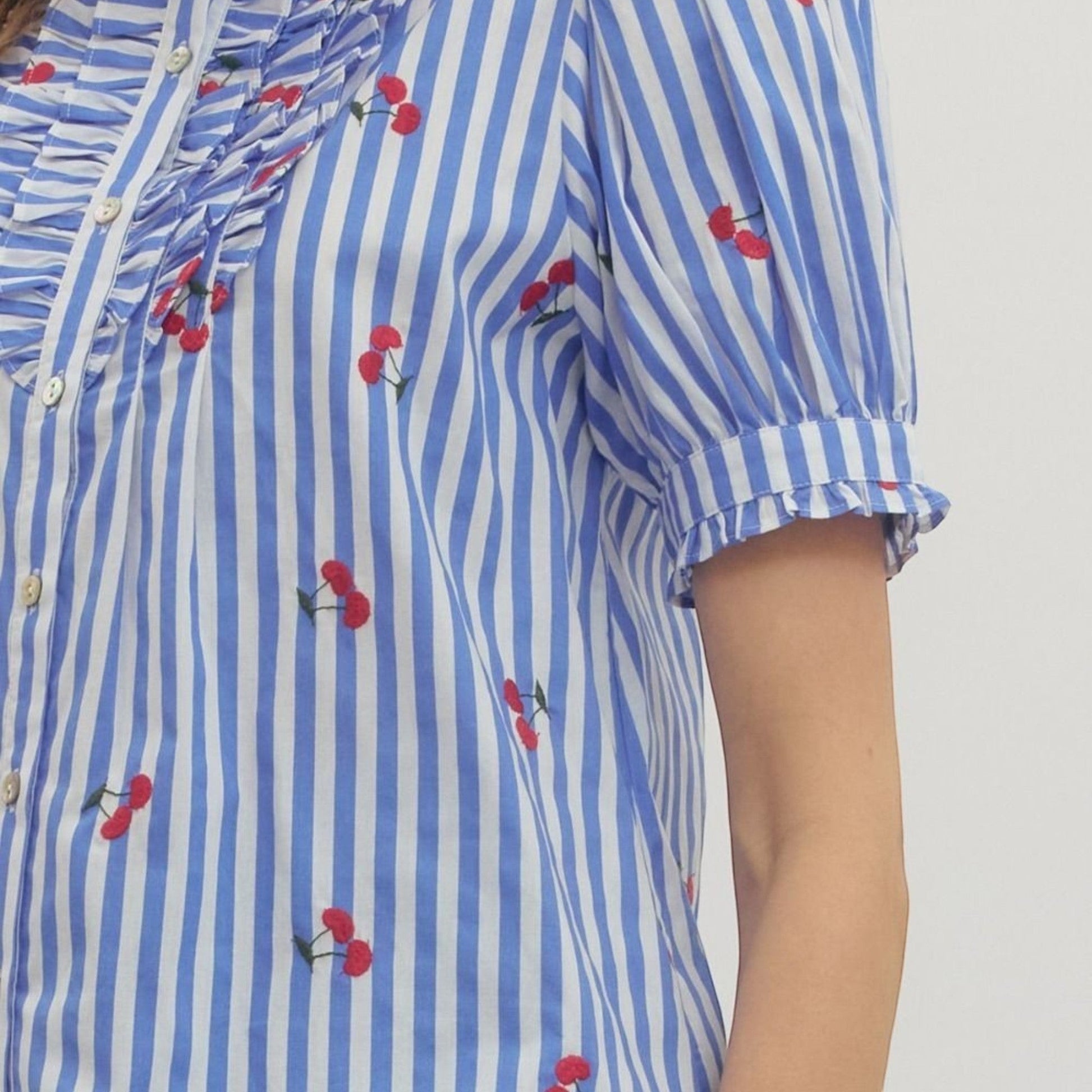The Merry Hare blue and white striped cotton top with embroidered cherries and puff sleeves.