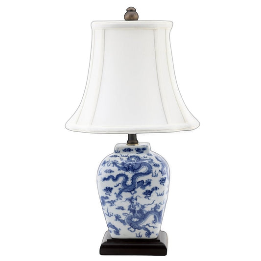 The Merry Hare Blue & White Chinoiserie Dragon Lamp with white shade, 18" tall, featuring intricate dragon motif.