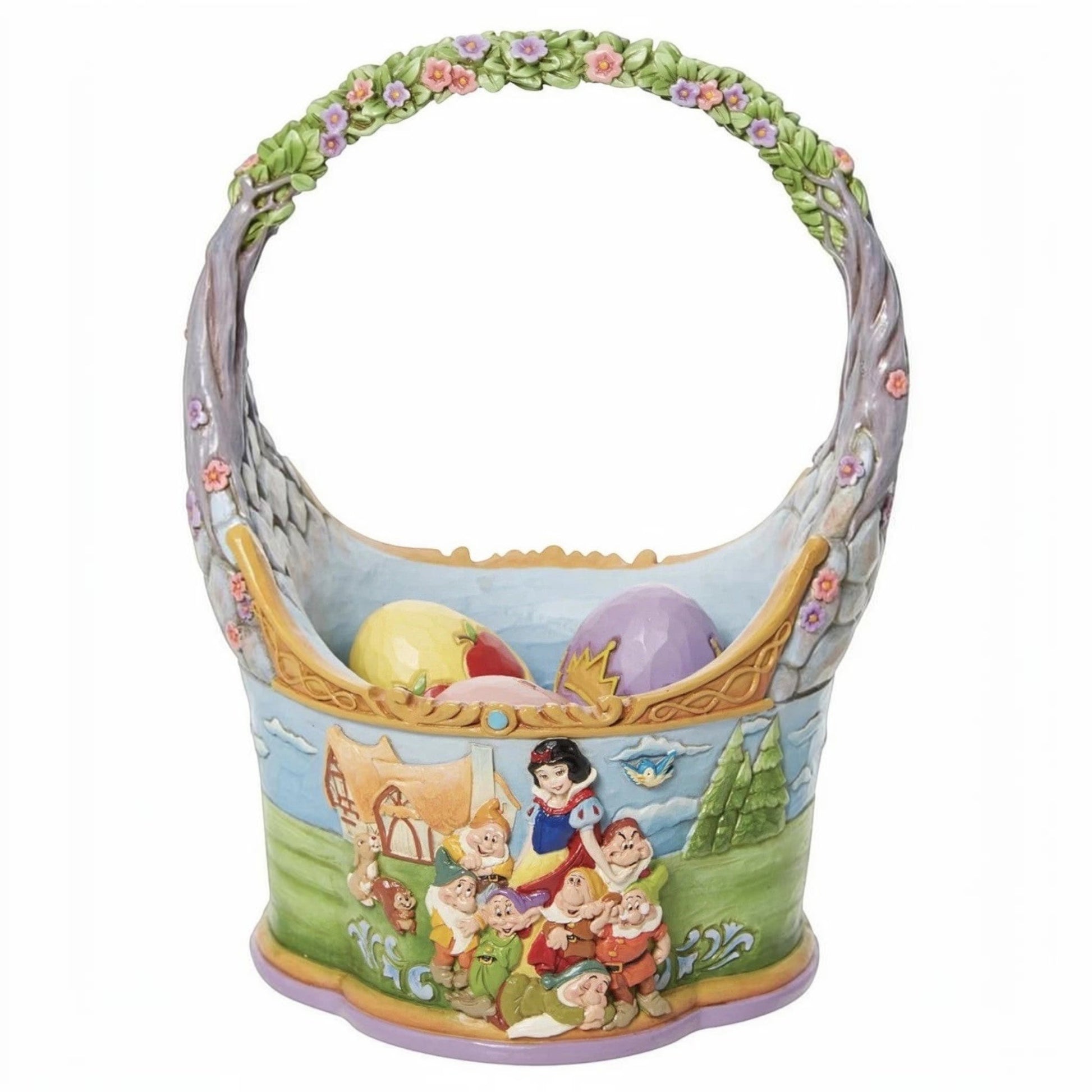 The Merry Hare Jim Shore Disney Snow White Easter basket with 3 eggs, featuring Snow White and the Seven Dwarfs. Decorated with flowers.