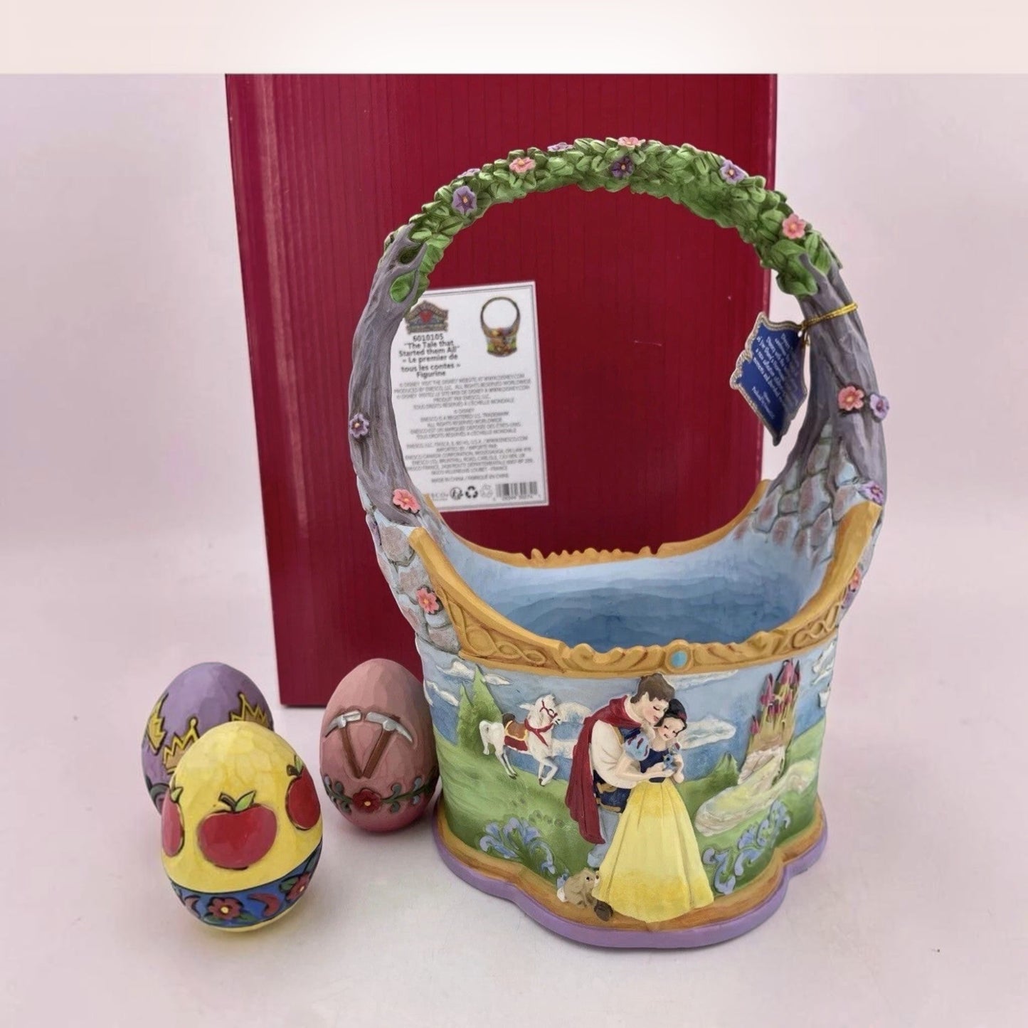 The Merry Hare Jim Shore Disney Snow White Easter basket with 3 decorative eggs. Features Prince Charming and Snow White.