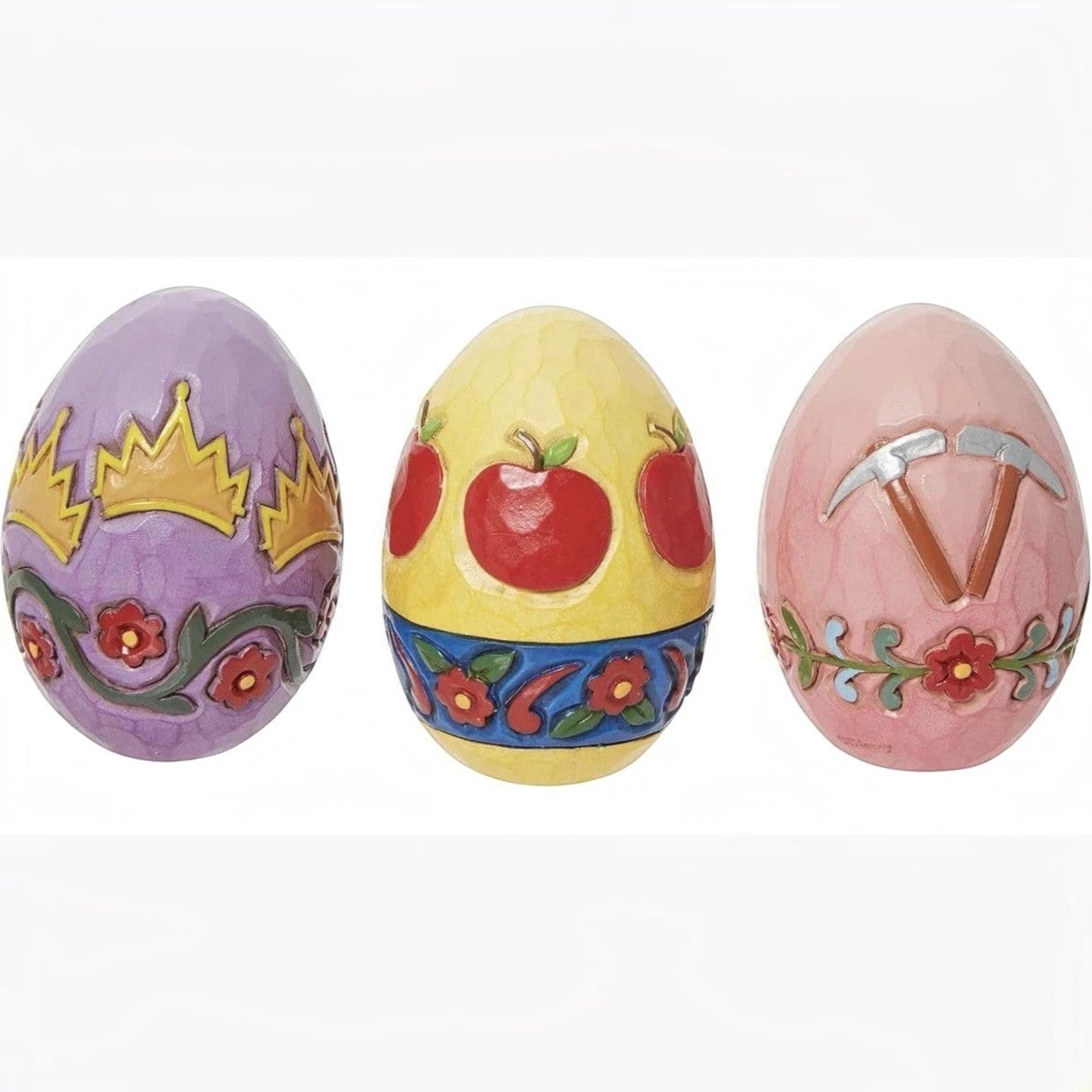 The Merry Hare Jim Shore Disney Snow White Easter eggs with crown, apples, and pickaxes. Purple, yellow, and pink.