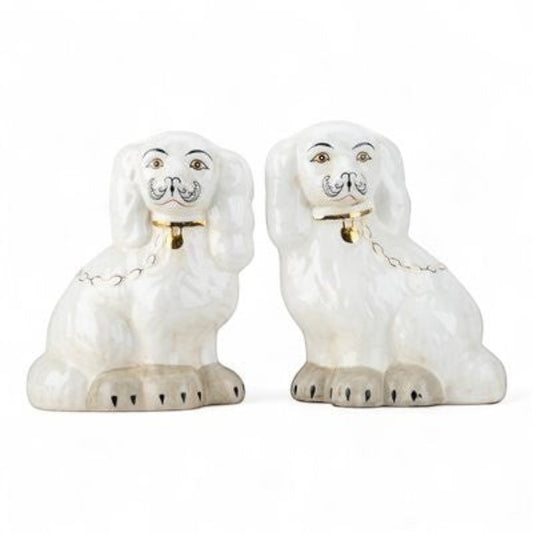 The Merry Hare pair of antique white Staffordshire dog figurines with gold locket detailing and hand-painted faces.