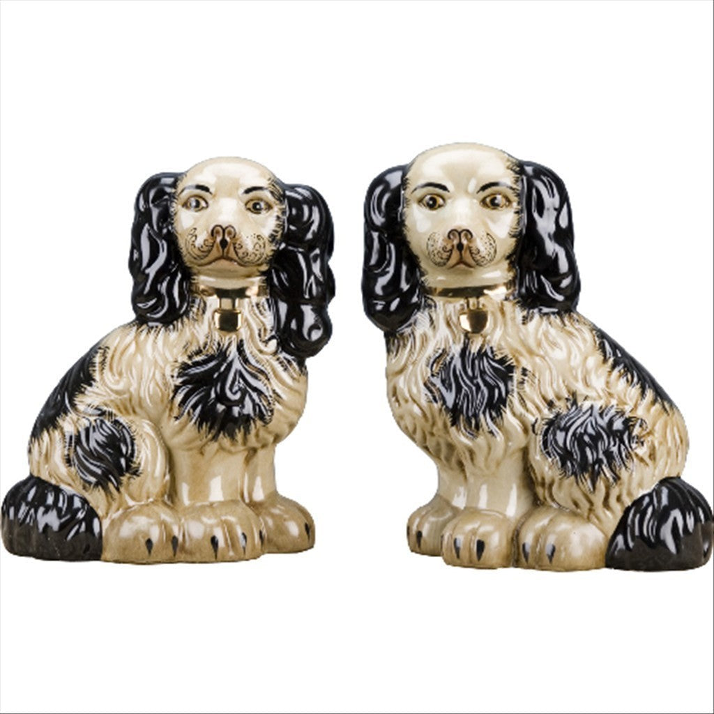 The Merry Hare pair of large Staffordshire Chinoiserie dog figurines in black and cream with gold locket detailing.