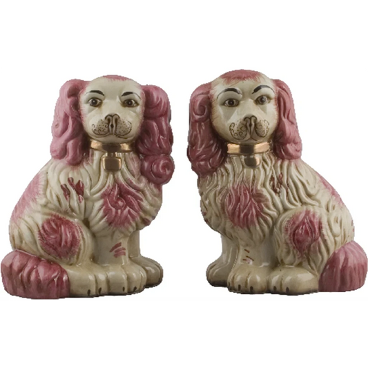 The Merry Hare pair of pink and cream Staffordshire dog figurines with gold locket detailing.