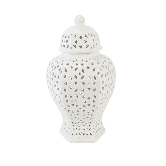 a white vase with holes