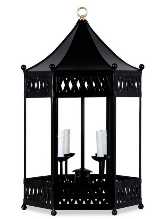 a black metal lantern with candles