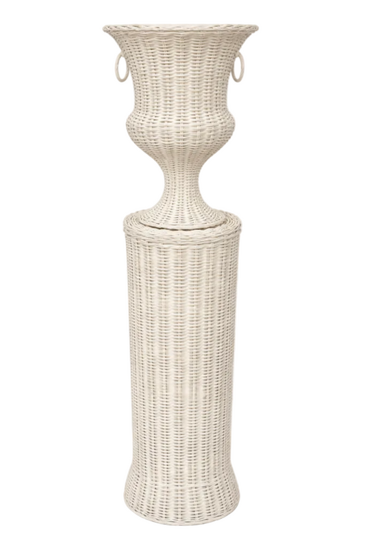 a white wicker stand with a round base